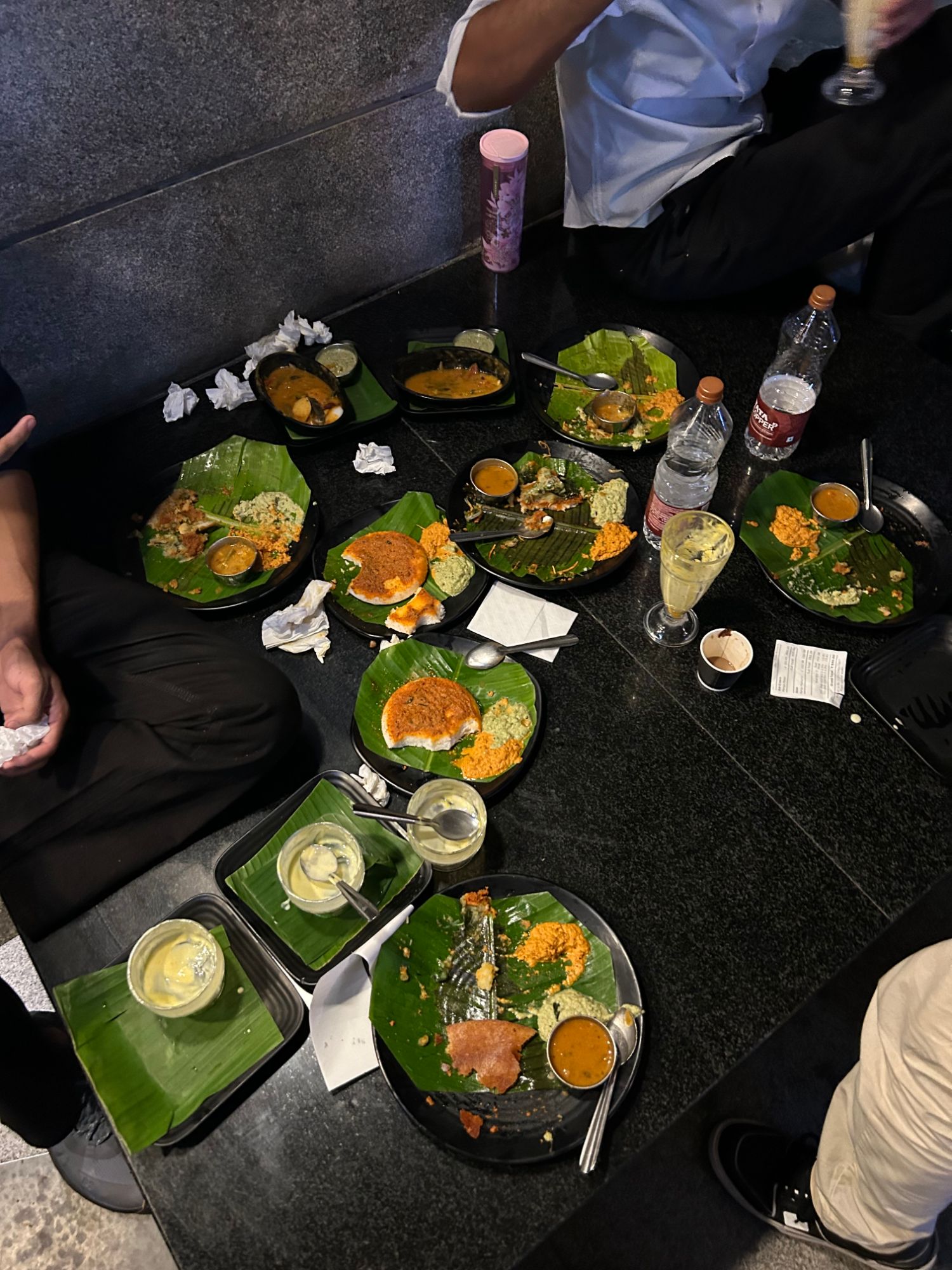 Shared South Indian meal served on banana leaves